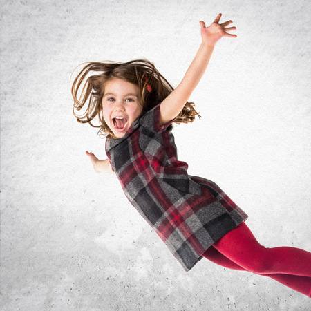 Little girl flyingの写真素材