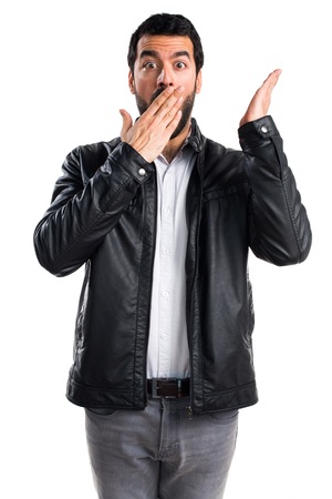 Man with leather jacket doing surprise gestureの写真素材