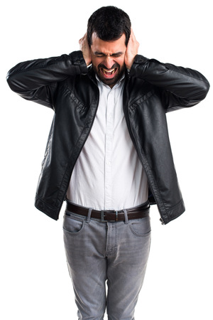 Man with leather jacket covering his earsの写真素材