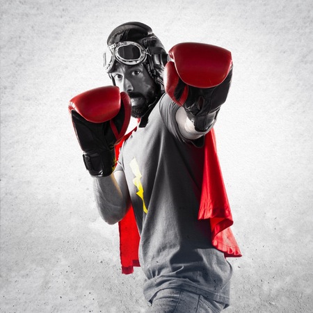 Superhero with boxing gloves making stop signの写真素材