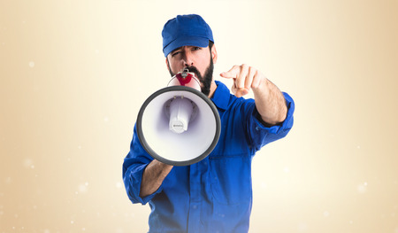 Plumber shouting by megaphoneの写真素材