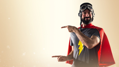 Superhero pointing to the lateralの写真素材