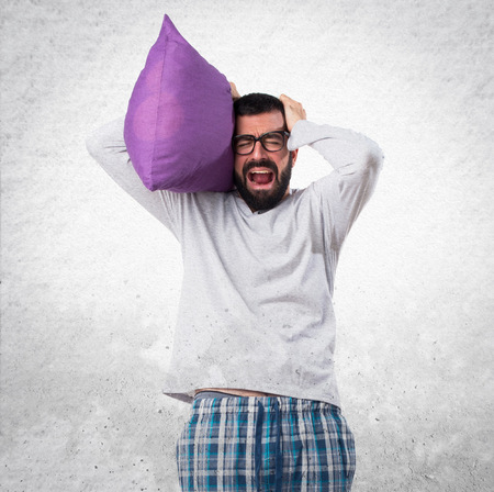 frustrated man in pajamasの写真素材