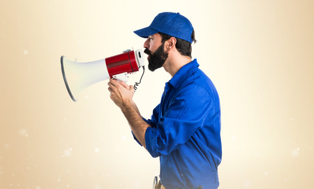 Plumber shouting by megaphoneの写真素材