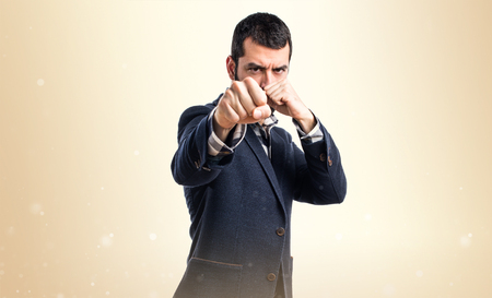 Handsome man giving a punchの写真素材