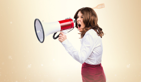 Waitress shouting by megaphoneの写真素材
