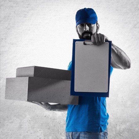 Delivery man with folderの写真素材