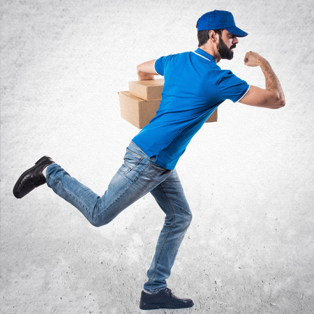 Delivery man running fastの写真素材