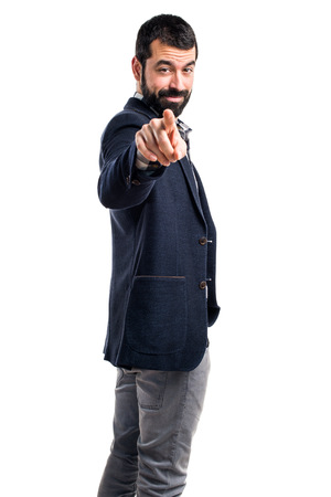 Handsome man pointing to the frontの写真素材