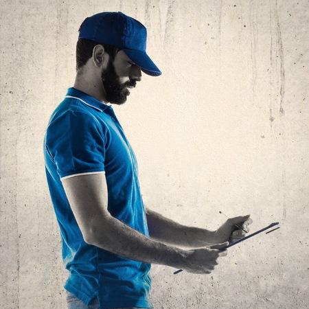Delivery man with folderの写真素材
