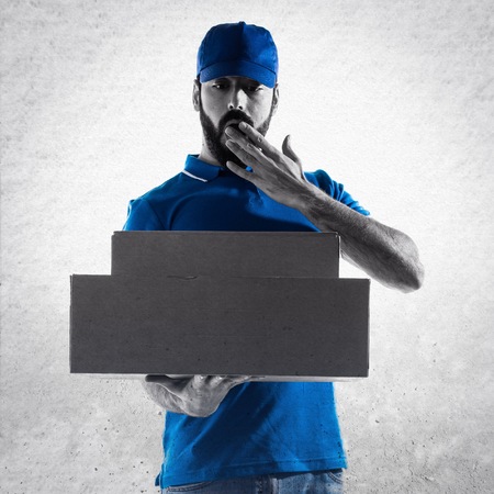 Delivery man doing surprise gestureの写真素材