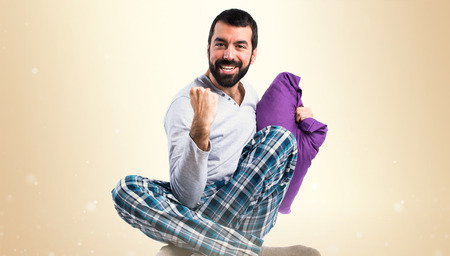 Lucky man in pajamasの写真素材