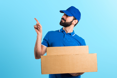 Delivery man thinkingの写真素材