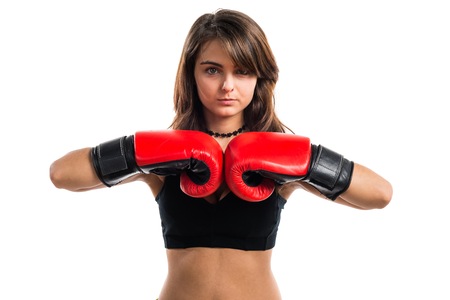 Young girl with boxing glovesの写真素材