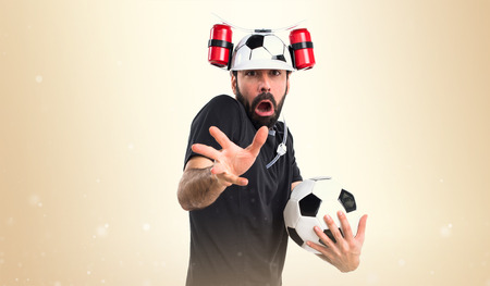 Crazy football player doing surprise gesture