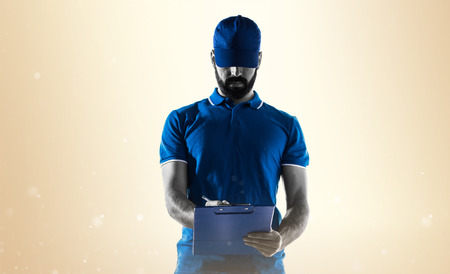 Delivery man with folderの写真素材