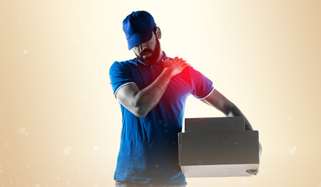 Delivery man with shoulder painの写真素材