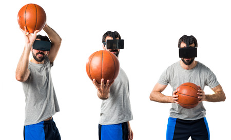 Man playing basketball using VR glassesの写真素材
