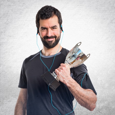 Sportman holding a trophyの写真素材