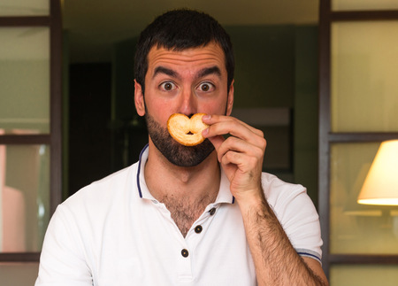 Man drinking orange juice in a hotelの写真素材