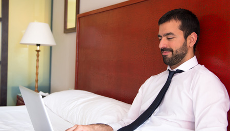 Young businessman worning in hotelの写真素材