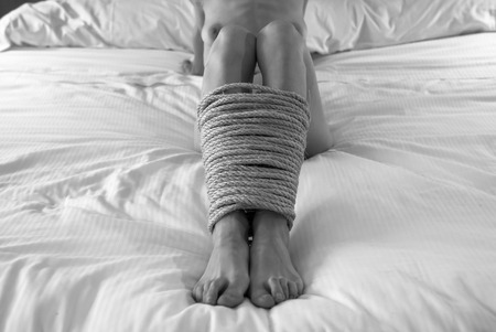 Submissive woman in luxury hotelの写真素材