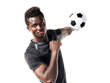 Black man playing footballの写真素材