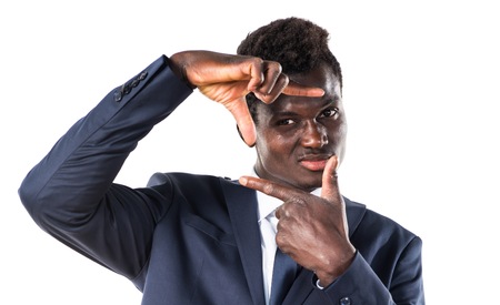 Black man focusing with his fingersの写真素材
