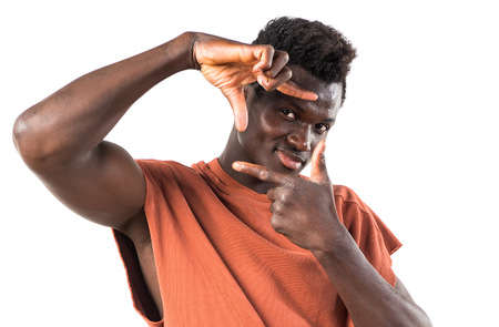 Handsome black man focusing with his fingersの写真素材