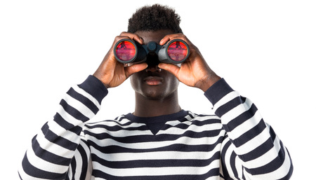 Handsome black man with binocularsの写真素材