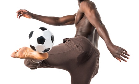 Black man playing footballの写真素材