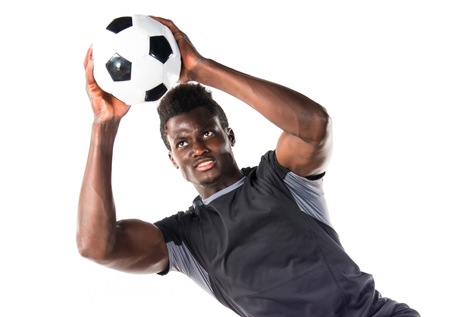 Black man playing footballの写真素材
