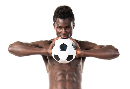 Black man playing footballの写真素材