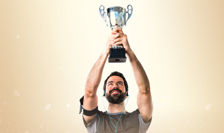 Sportman holding a trophyの写真素材