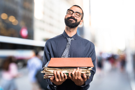 Man holding several college notesの写真素材