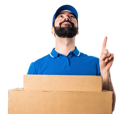 Delivery man pointing upの写真素材