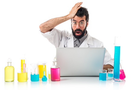 Scientist with his laptop doing surprise gestureの写真素材