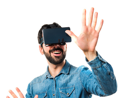 Man using VR glasses touching on transparent screen