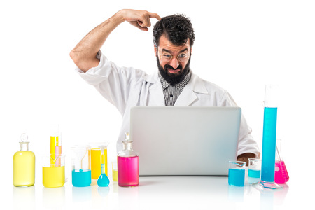 Scientist with his laptop thinkingの写真素材