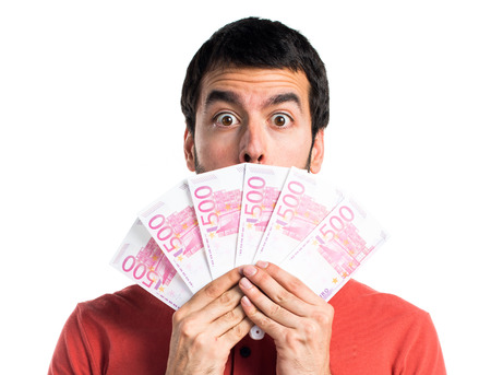 Handsome man taking a lot of money