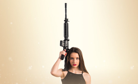Young girl holding a rifle