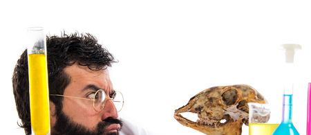 Crazy scientist man with skullの写真素材