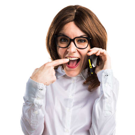 Teen student girl talking to mobileの写真素材