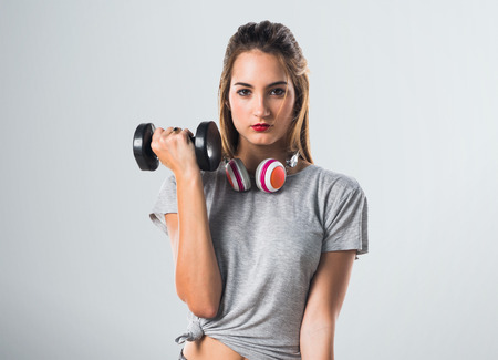 Young woman doing weightliftingの写真素材
