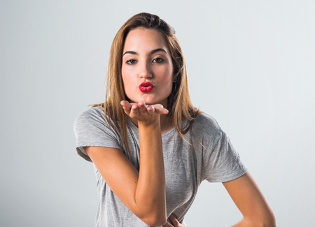 Woman sending a kissの写真素材