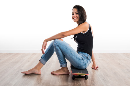 Young cute girl with skate