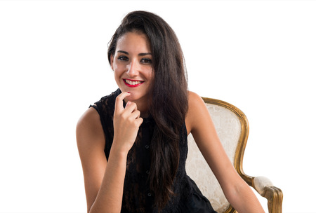 Pretty girl on vintage armchairの写真素材