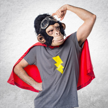 Superhero monkey man having doubtsの写真素材