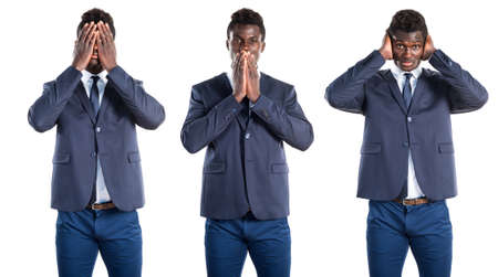 Handsome black man covering his mouthの写真素材