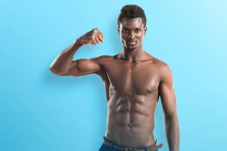 Handsome black man with athletic body posingの写真素材